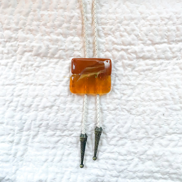 orange glass bolo tie