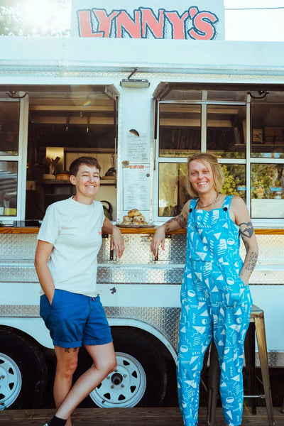 photo of Erin Gentry and Lynn Metcalf in front of food trailer Lynny's