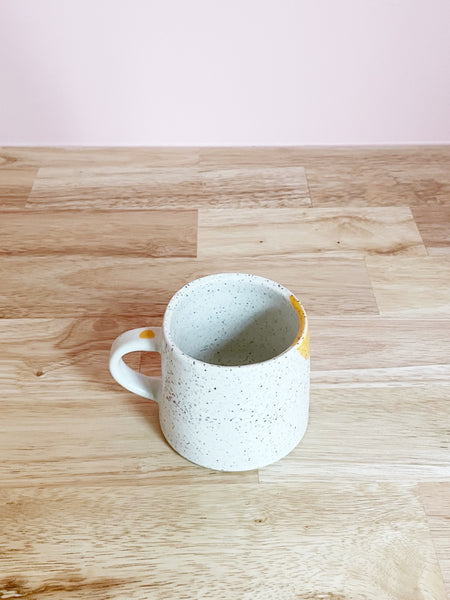 yellow and cream speckled mug