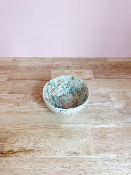 white and multicolor splatter glazed ceramic bowl